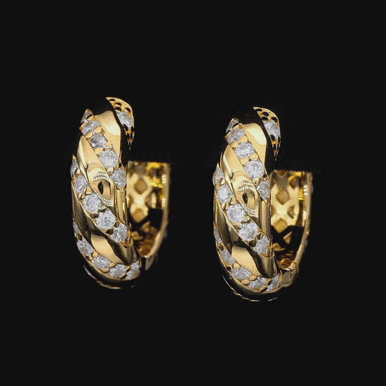 Gold hoop earrings with diamond accents on a white background