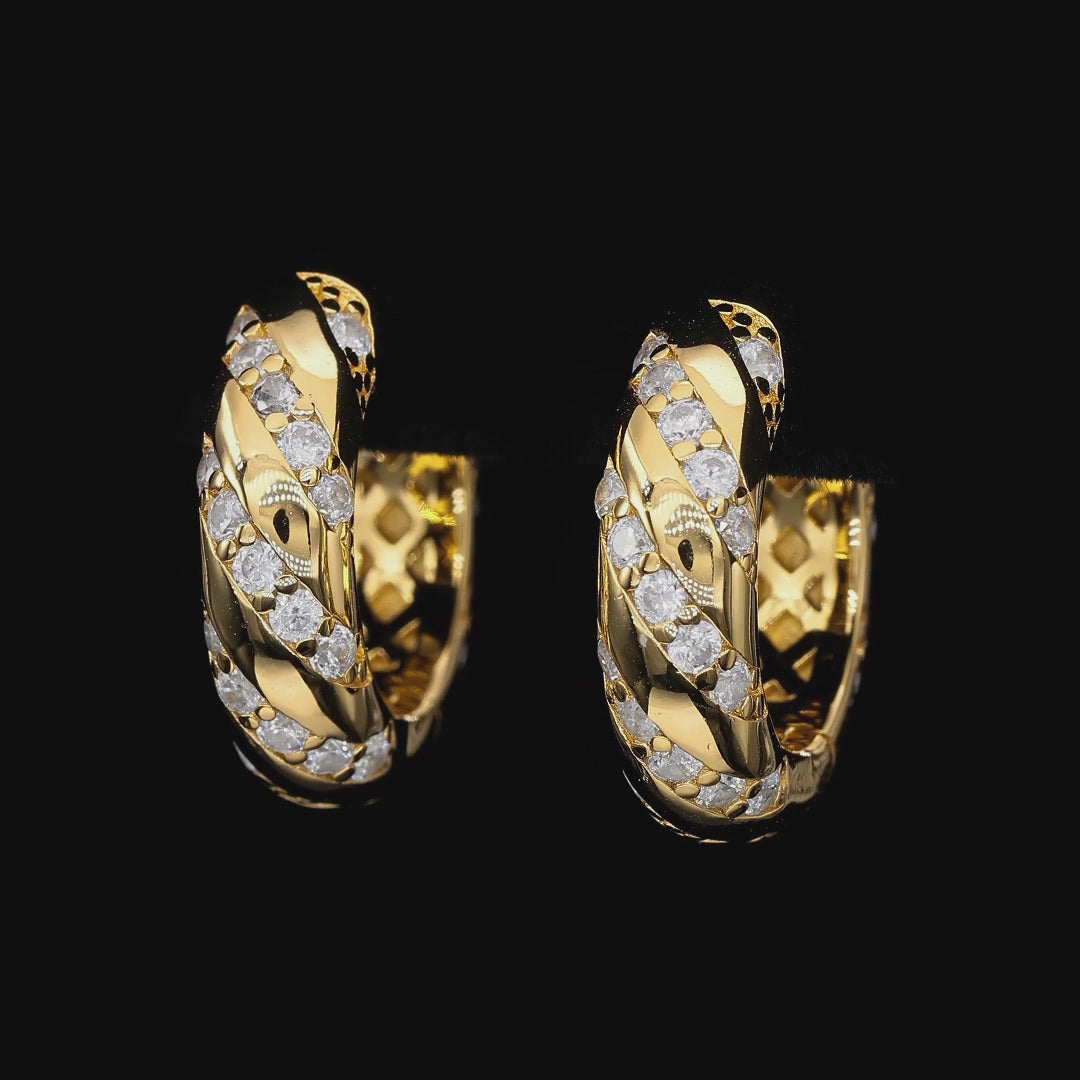 Gold hoop earrings with diamond accents on a white background